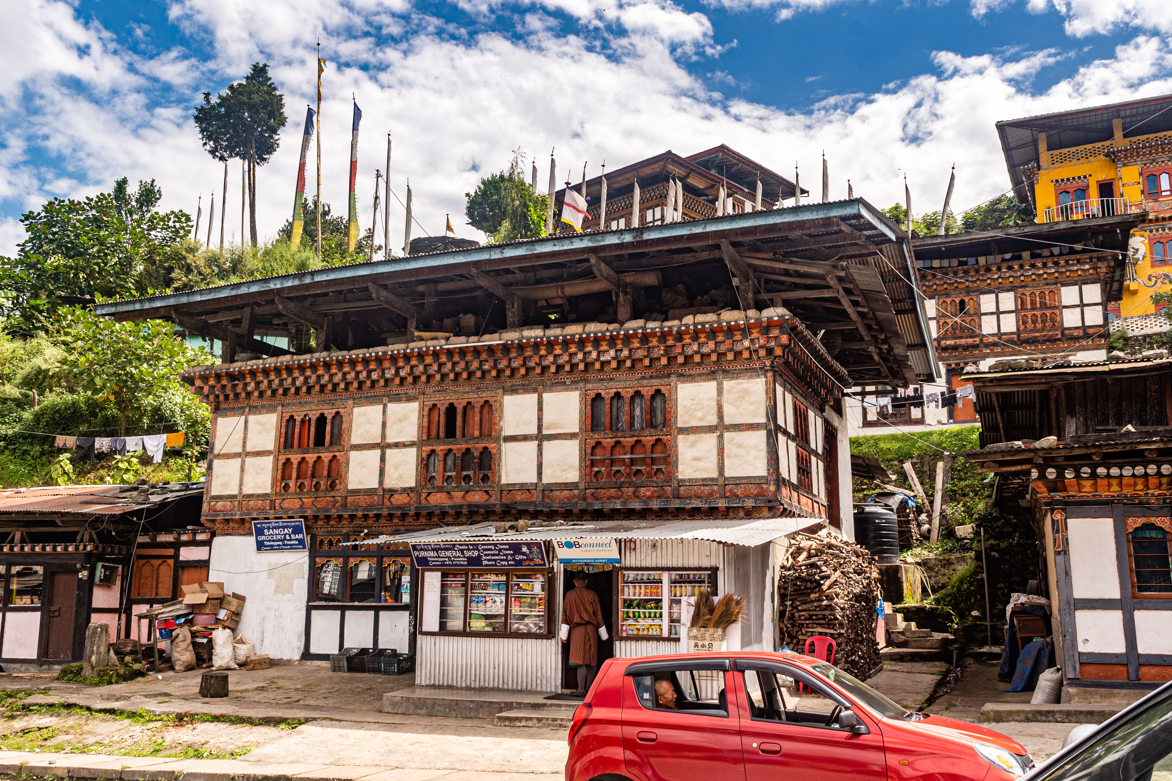 Traditional Bhutanese street with local shops and homes
